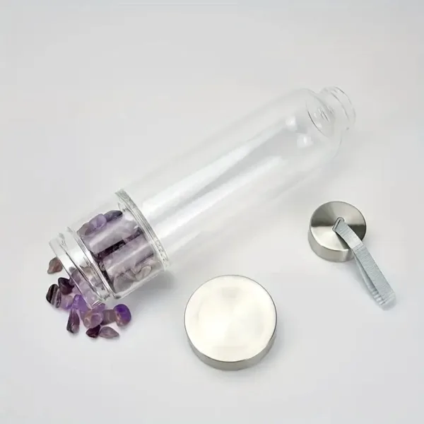 Glass water bottle with amethyst stones.