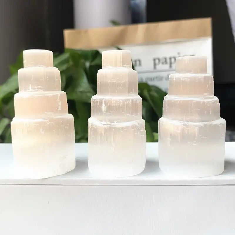 Three white selenite crystal towers.