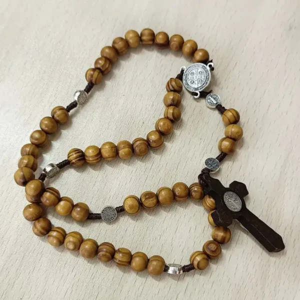 Brown wooden rosary with silver accents.