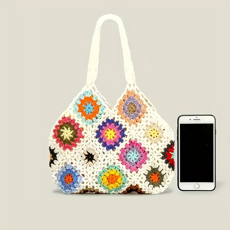 White crochet bag with floral pattern.