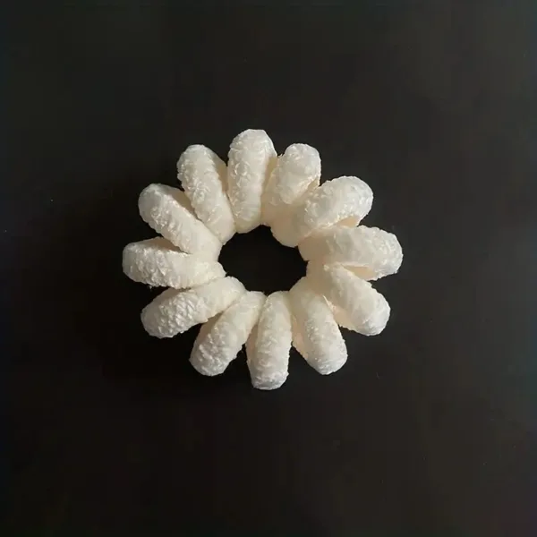 White foam packing peanuts in a circle.