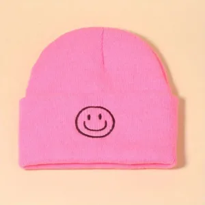 Pink beanie with a smiley face.