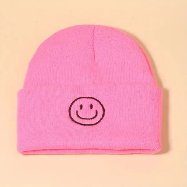 Pink beanie with a smiley face.