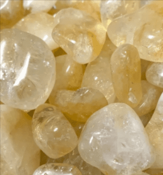 Close-up of tumbled citrine stones.