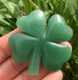 Green jade four-leaf clover charm.