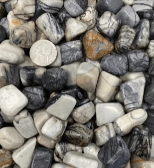 Close-up of tumbled zebra jasper stones.