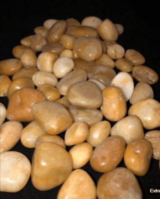 A pile of smooth, tan pebbles.