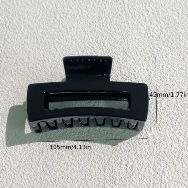 Black large plastic hair claw clip.