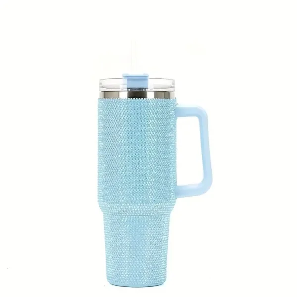 Blue rhinestone tumbler with handle and straw.