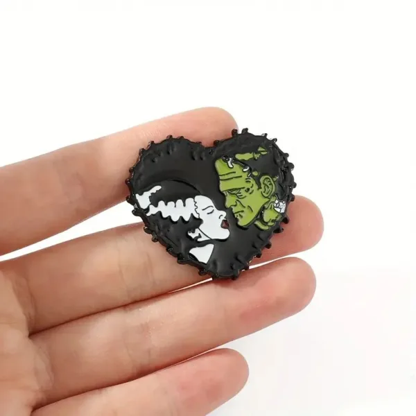 Heart-shaped pin of Frankenstein and bride.