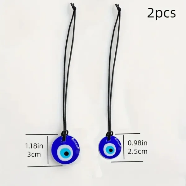 Two blue evil eye pendants on black cords.