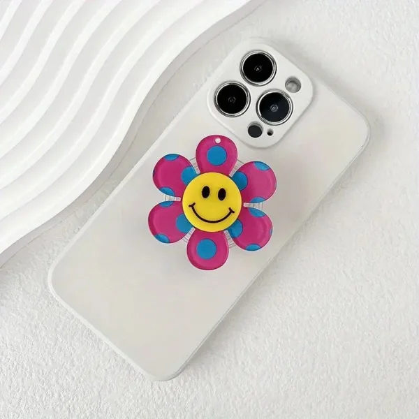 White phone case with smiley flower.