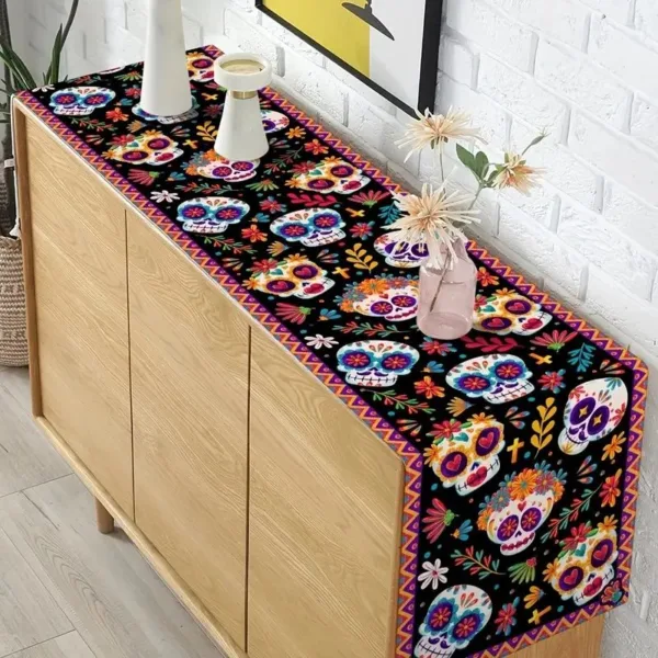 Black table runner with colorful sugar skulls.