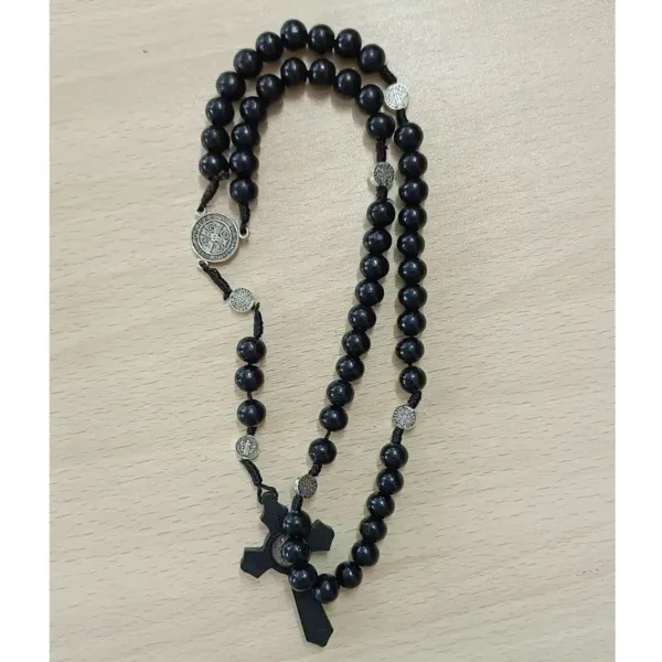 Black wooden rosary with silver accents.