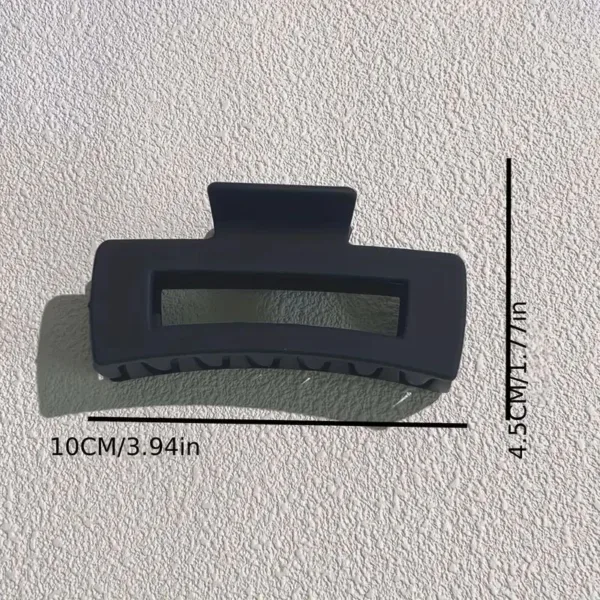 Black plastic hair claw clip.