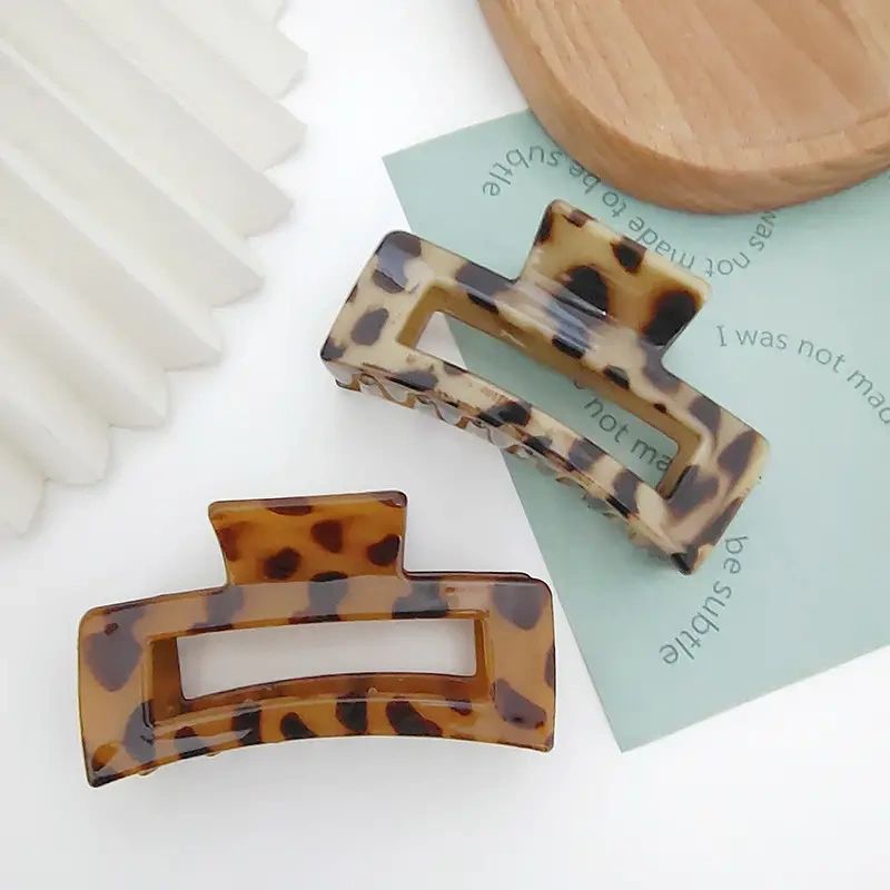 Two leopard print hair clips.