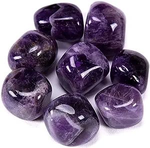 Close-up of smooth purple amethyst stones.