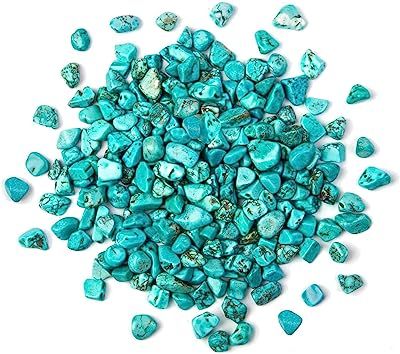 Turquoise gemstone chips on white background.