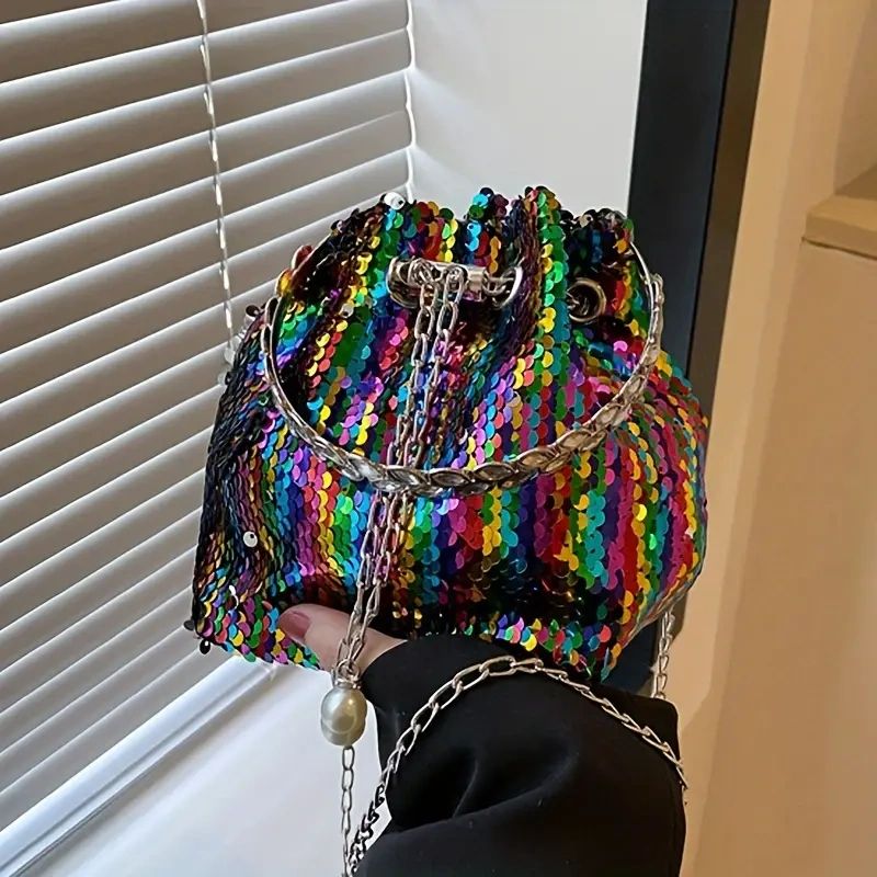 Rainbow sequin bucket bag with chain handle.