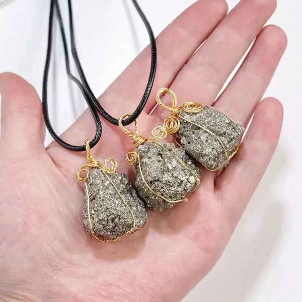 Three gold-wrapped pyrite necklaces.