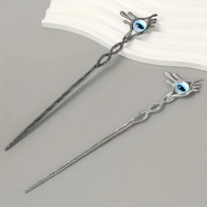 Two silver hair sticks with blue eye design.