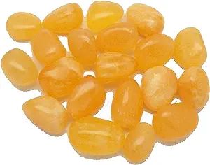 A group of yellow carnelian tumbled stones.