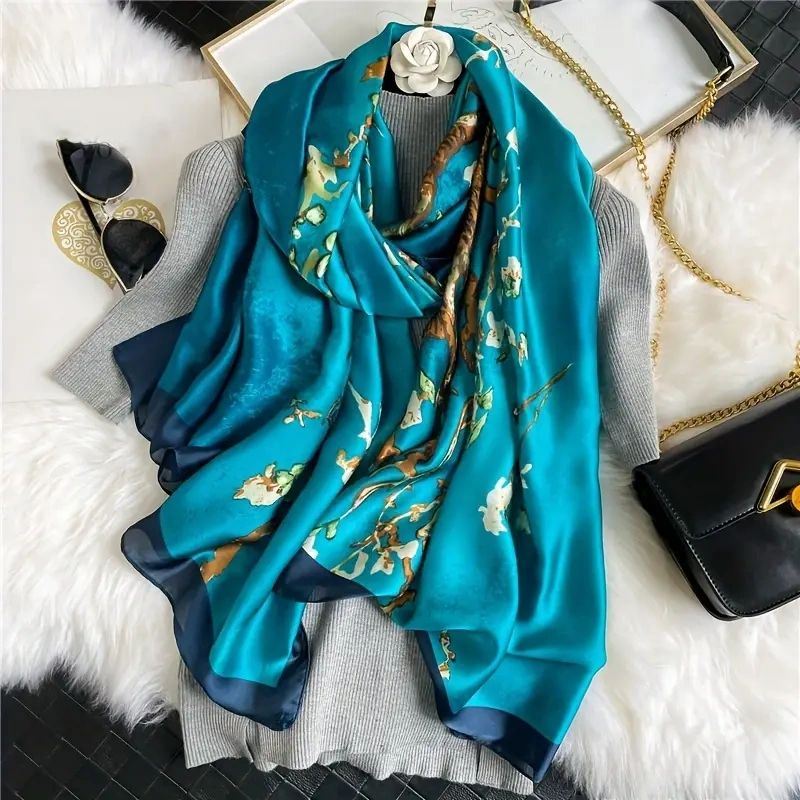 Blue silk scarf with floral print.