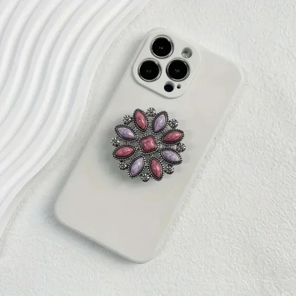 White phone case with jeweled ring holder.