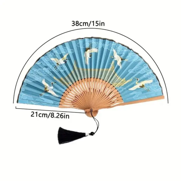 Blue and white hand fan with crane design.