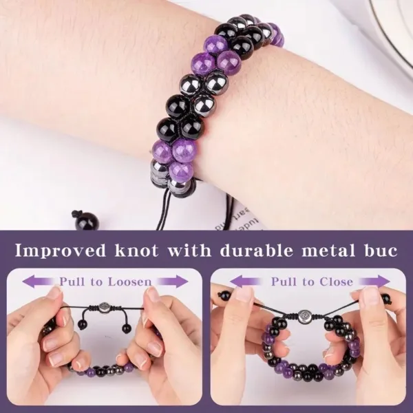 Purple and black beaded bracelet with metal buckle.