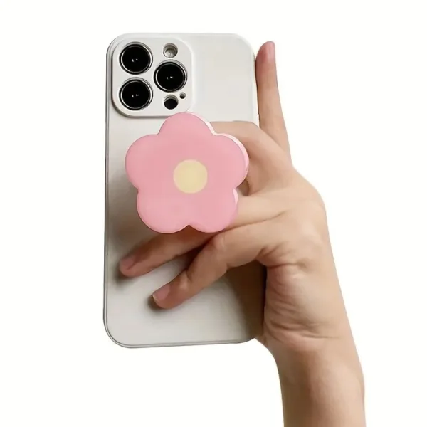 White phone case with pink flower grip.