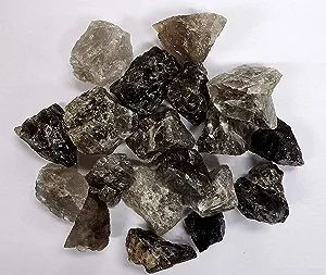 Smoky quartz rough stones on white background.