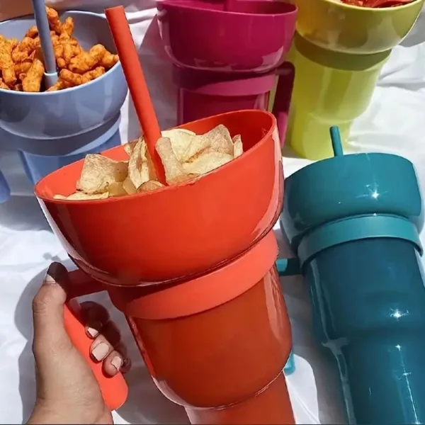 Orange snack holder with chips and straw.