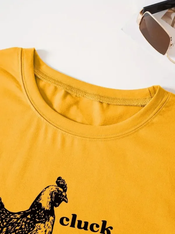 Yellow t-shirt with black chicken and text.