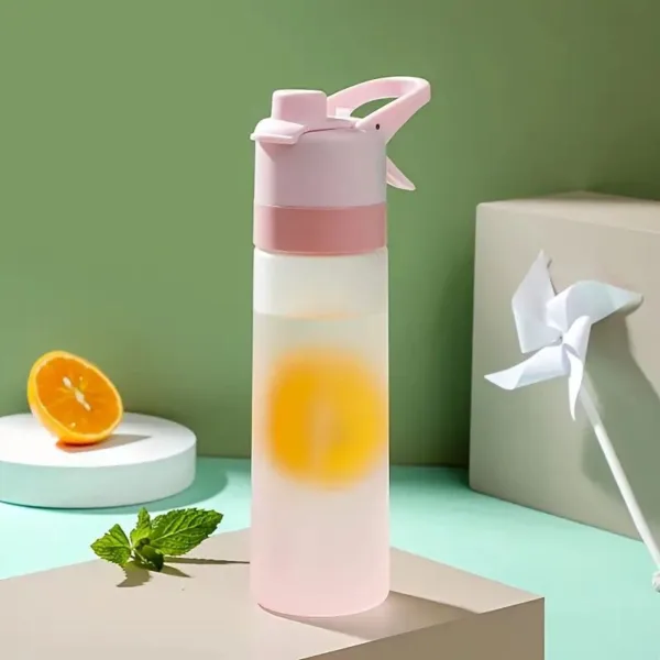 Pink water bottle with yellow fruit slice.