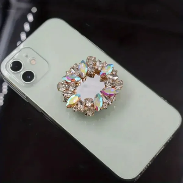 White phone with jeweled ring holder.