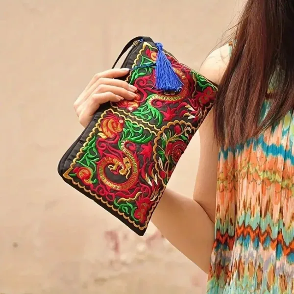 Black clutch with colorful embroidery.