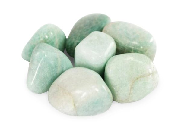 Green tumbled gemstones on white background.