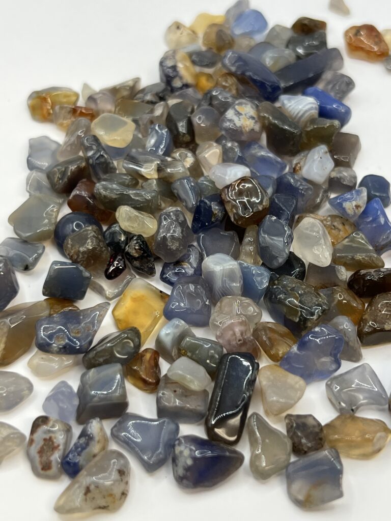 Assortment of blue, brown, and white gemstones.