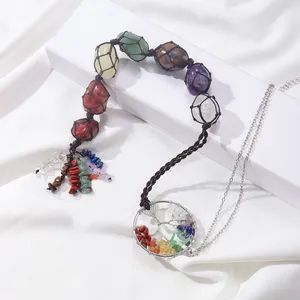 Multi-colored crystal necklace with chakra pendant.