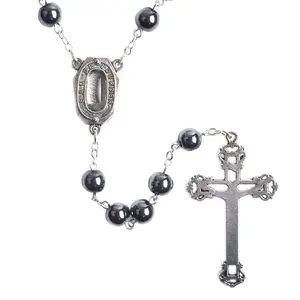 Silver rosary with black hematite beads.