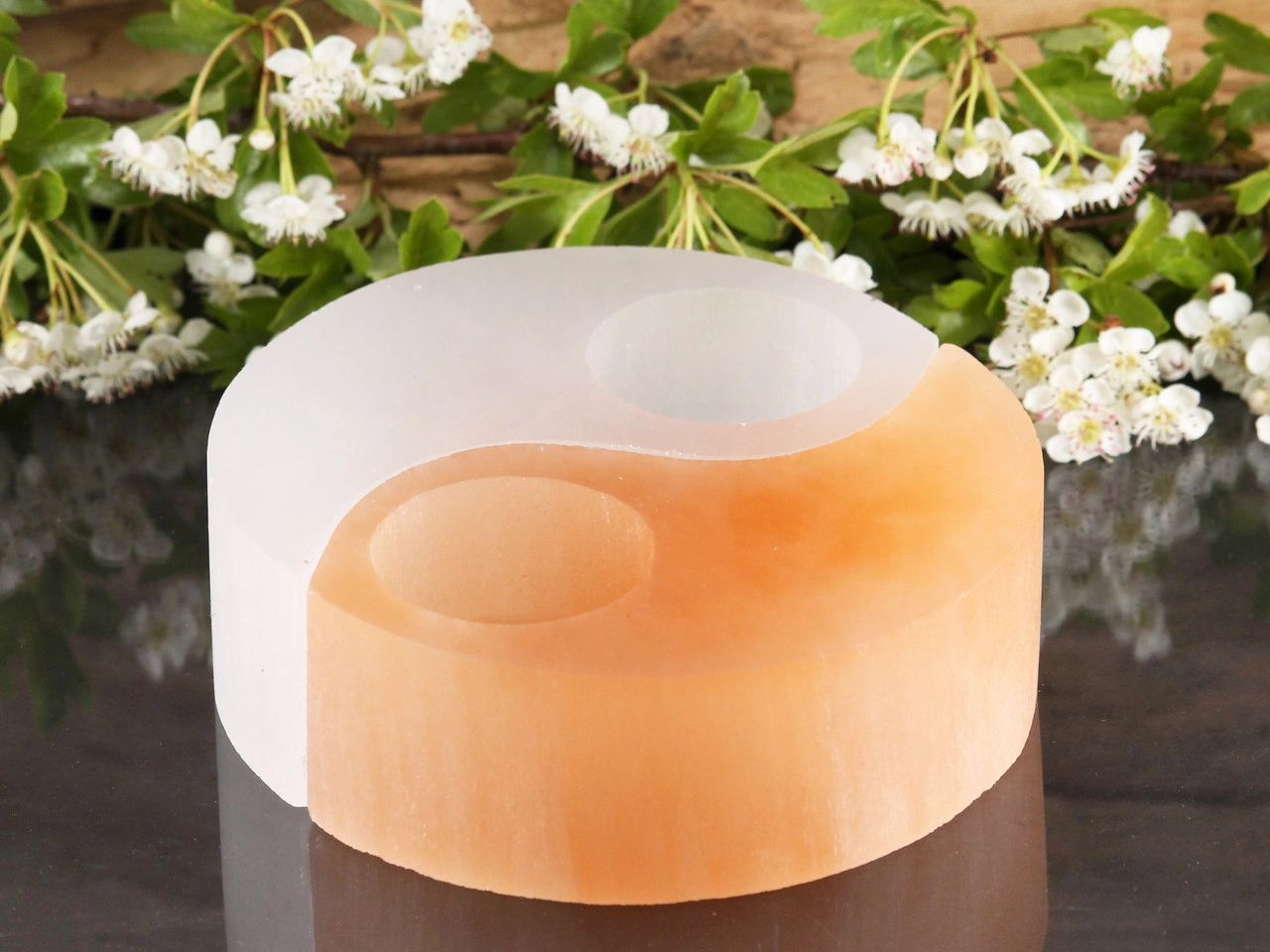 Salt candle holder in yin yang shape.