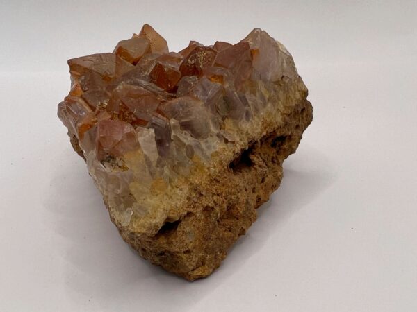 Quartz crystal cluster in rough rock.