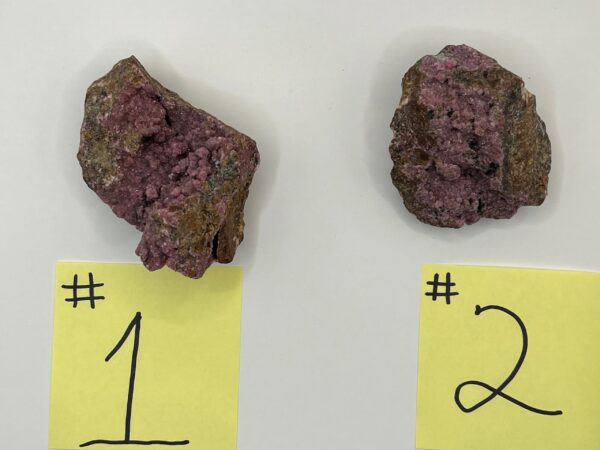 Two pink and brown mineral samples.