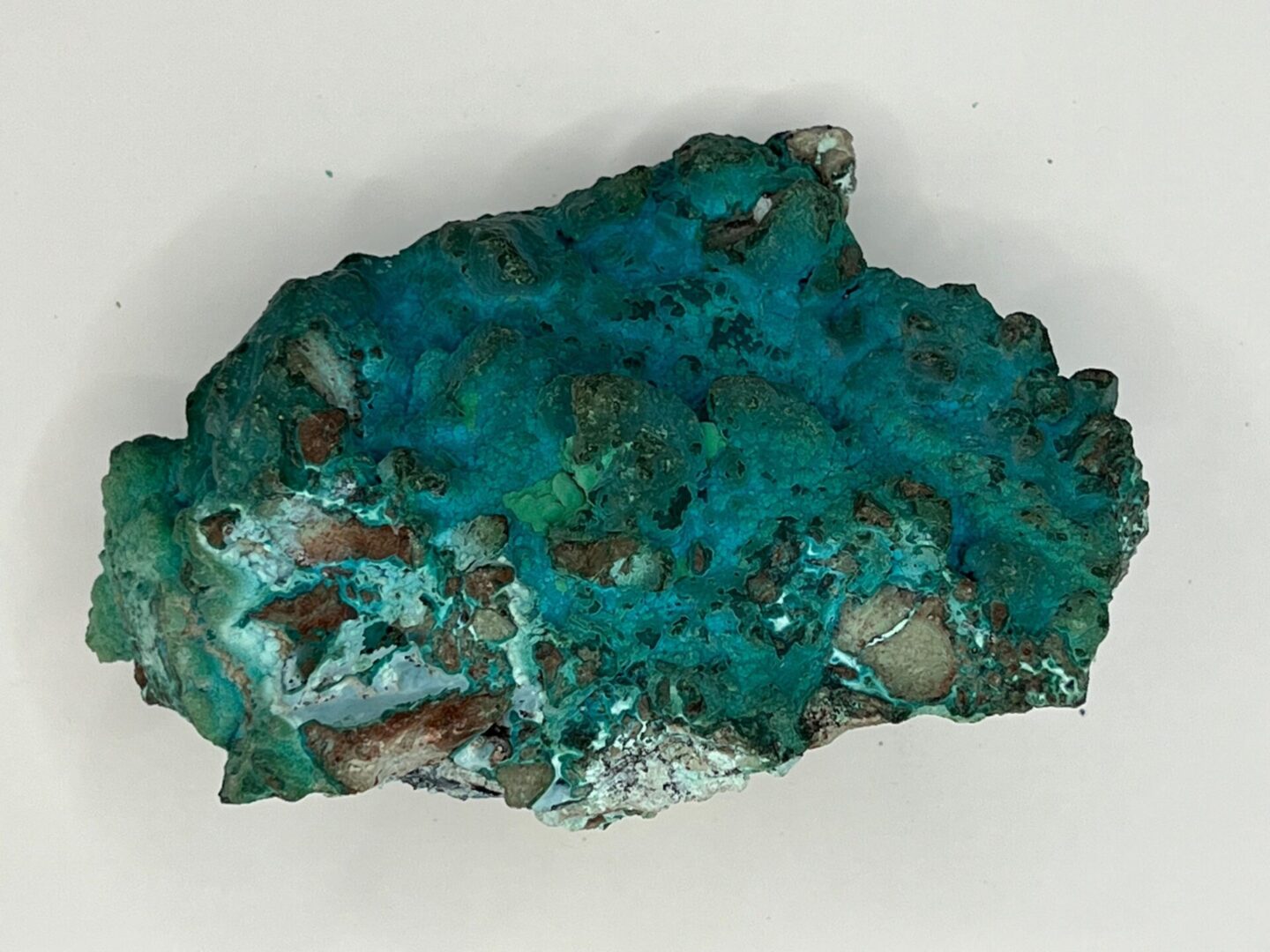 Blue green rough gemstone specimen.