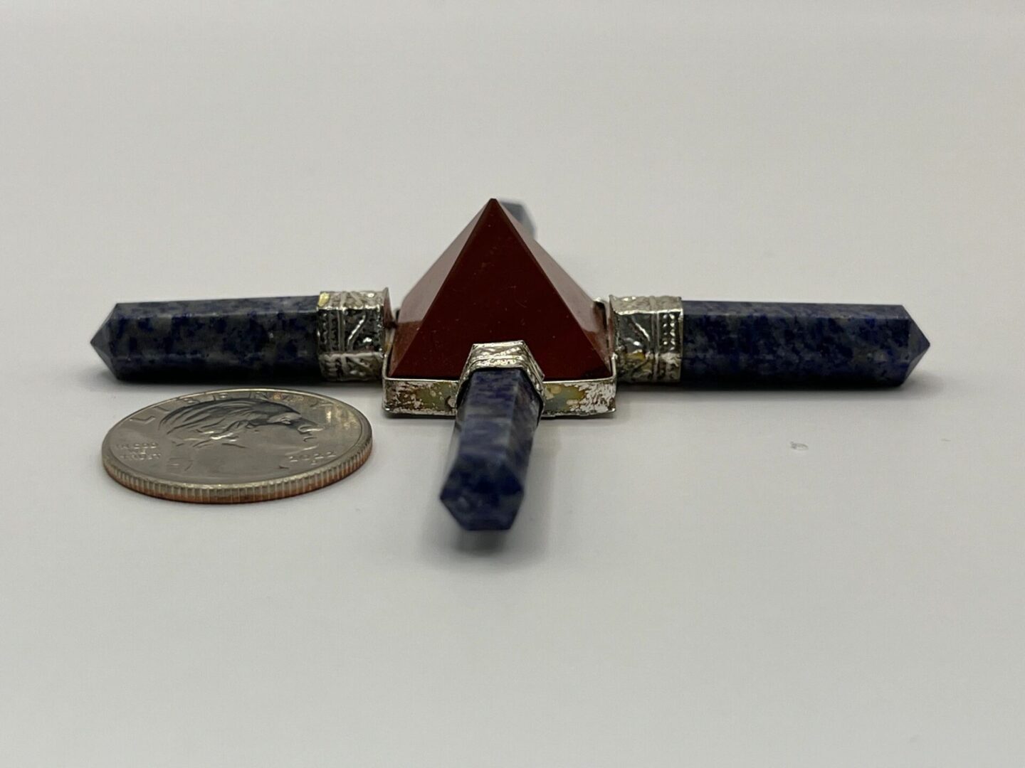 Orgonite pyramid with blue stones.