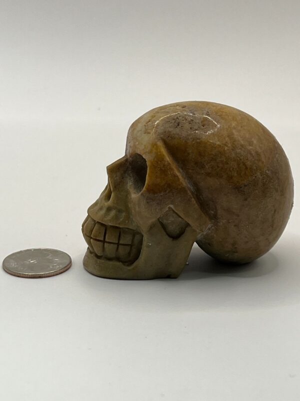 Carved stone human skull figurine.