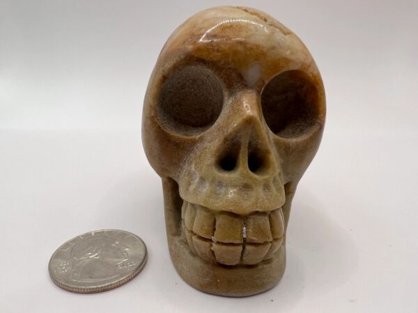 Carved stone human skull sculpture.