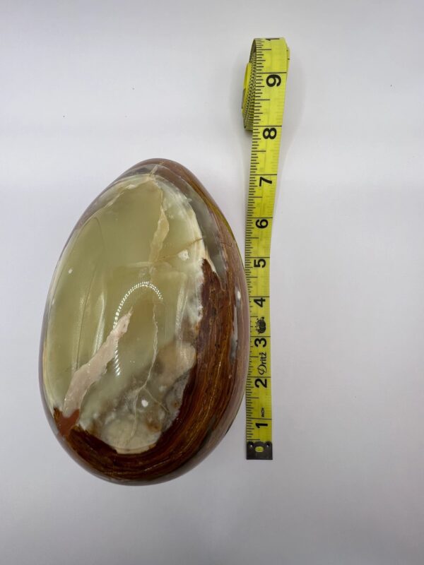 Green and brown marble egg shaped bowl.