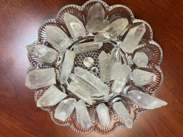 Clear quartz crystals on a plate.